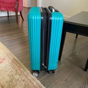 Delsey Paris roll away carry on luggage